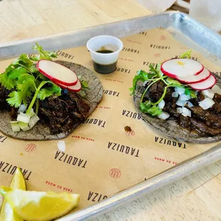 Barbacoa (left) &amp; carne asada (right) tacos