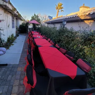 a long table with red tablecloths