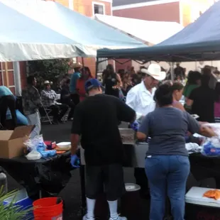 a group of people at a food stand