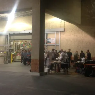 a group of people outside a store