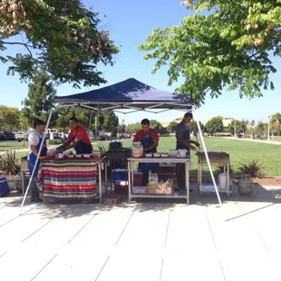 Guys from El Unico set up for an event. Savory beef and chicken tacos served hot with onions, salsa and guacamole. Terrific!