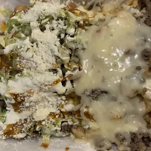 Munchie box - half asada fries, half -3 rolled tacos w/ chicken