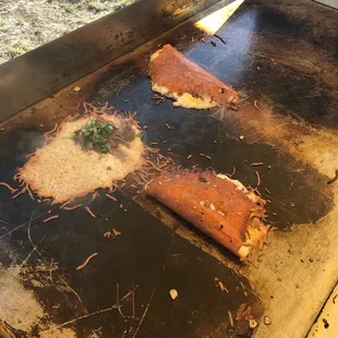 a hot dog on a grill