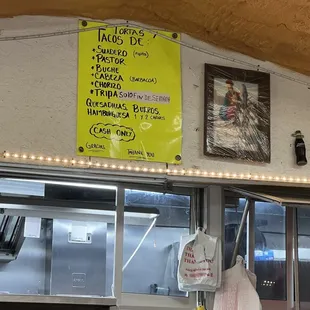 Menu on wall, no prices?