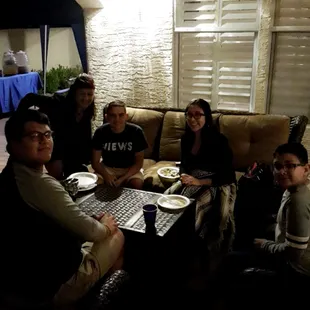 Enjoying tacos next to the caterers set up