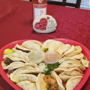 I won a Valentine&apos;s raffle heart shape platter of tacos and a wine bottle!!