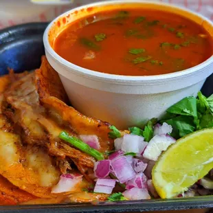 a bowl of soup and tortillas