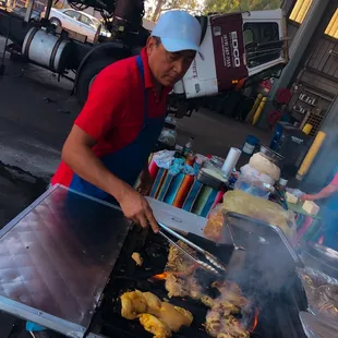 Victor grilling our tasty chicken for an event at EDCO