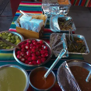 Fresh radishes, limes, variety of salsas made from scratch