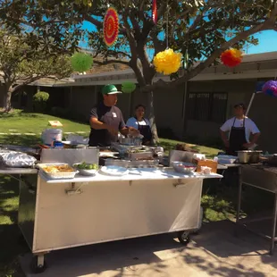 Victor and crew arranging the finishing details for a business&apos; grand opening