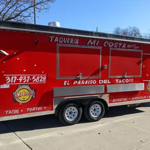 a taqueria truck parked on the side of the road