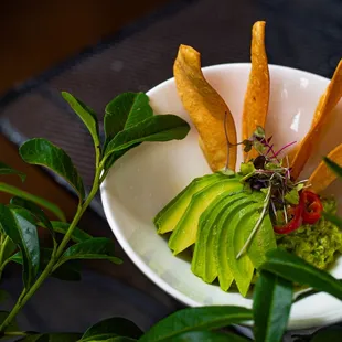 Guacamole and House Made Chips, available all day.  Pick another bite to pair with it for our happy hour!