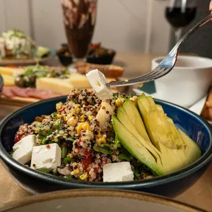 Our quinoa salad, featuring quinoa, avocado, heart of palm, peppers, walnuts, and arugula.  Topped with our house made honey dressing.