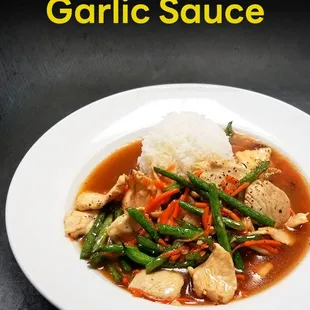 a plate of chicken and vegetables