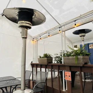Elegant outdoor dining with heat lamps
