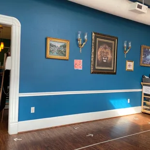 a dining room with blue walls