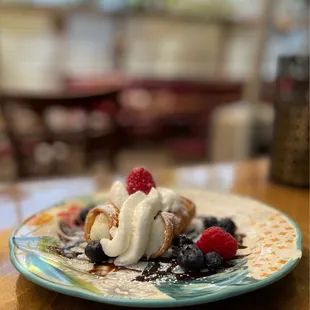 a plate of fruit and ice cream