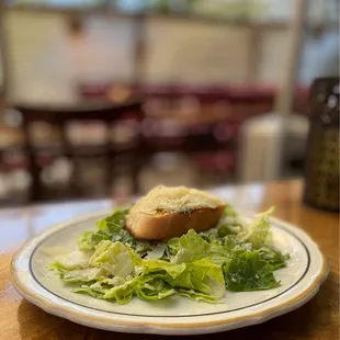 a plate of salad and bread