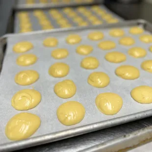 a tray of doughnuts on a baking sheet