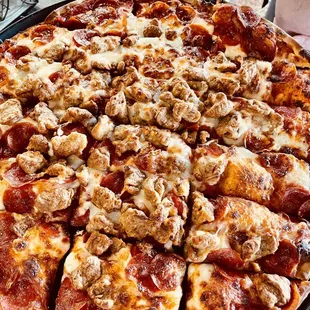 Pizza with pepperoni and Italian sausage
