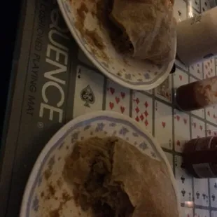 The left is the chicken curry roti wrapped. The right is the goat roti. Both great options.