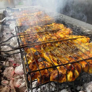 chicken cooking on a grill