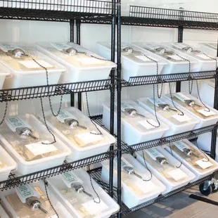 a rack of sinks with chains on them