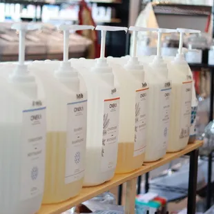 a row of hand sanitizers on a shelf