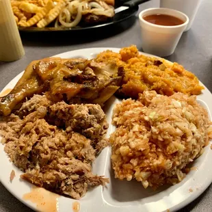 Not very pretty, but boy, it sure was tasty. Pork BBQ, 1/4 dark chicken, sweet potato casserole and bbq slaw.