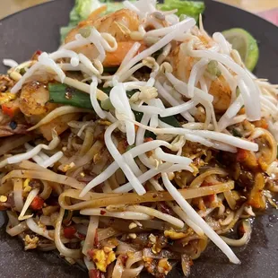 a plate of noodles and shrimp