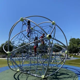 Cool webbed climbing structure.
