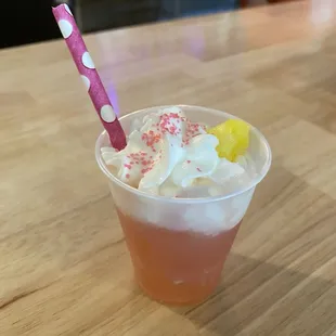 Flamingo Sour with whipped cream and sprinkles