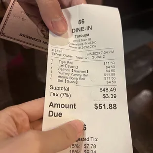 a receipt being held by a person