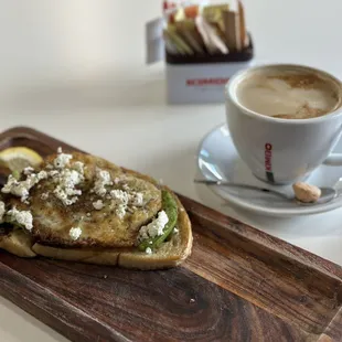 a sandwich and a cup of coffee