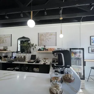 a coffee shop counter with a coffee maker