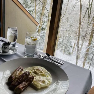 From À la cart, eggs over easy with sausages.