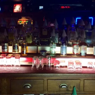 All of the snow cone tops on the liquor bottles resemble a KKK rally.