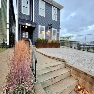 the front of the house and steps leading up to the front door