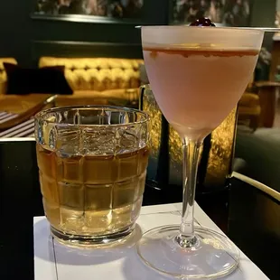 a cocktail and a drink on a menu