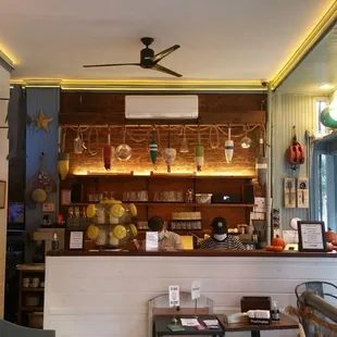 a view of a bar with a ceiling fan