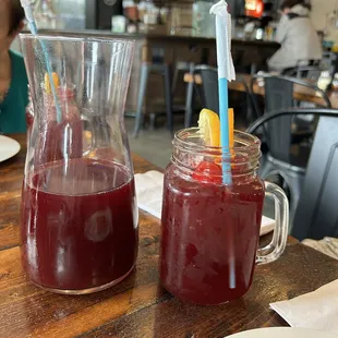 a pitcher and a jar of fruit juice