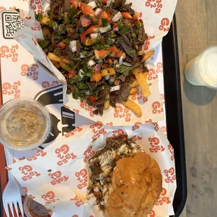 Baba Ganoush in the cup to the left, Garlic Sauce on the Right