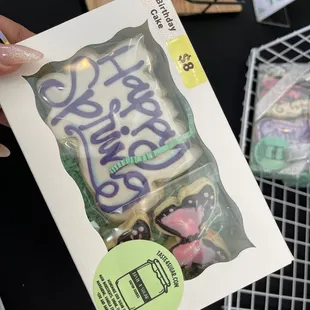 a person holding a package of cookies