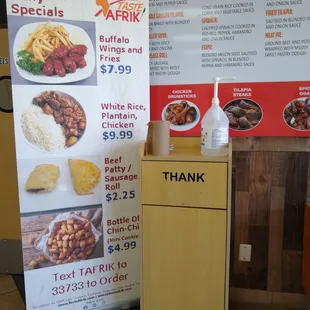 a table with a menu and a sign