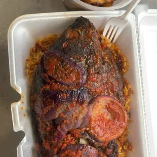 Whole Tilapia with jollof rice and plantains
