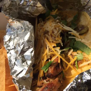 Taco al carbon. Chicken (in this case), cheese, cilantro, fried jalapeños, and pico sauce.