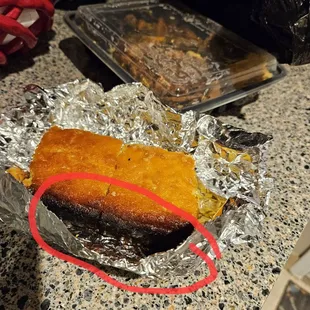 Burned cornbread! Y'all check that cornbread BEFORE leaving the restaurant.