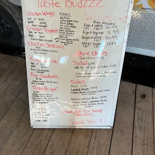 a menu on the side of a food truck