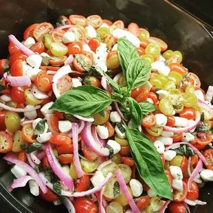 a salad with tomatoes and onions