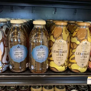a display of jars of lemonade and other beverages